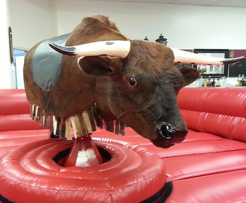 Close-up of The Beast mechanical bull inside its red inflatable safety ring