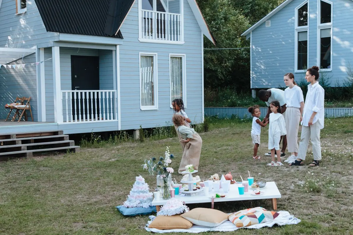Family playing games at a backyard birthday party